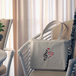 Stabile Tragetasche, mit weihnachtlichen G+F Notenschlüsseln bestickt, mit Reißverschluss